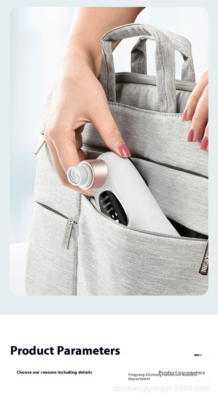 Hand holding the Oxygen Injection Skin Spray Beauty Instrument ready to use, designed for home skincare.